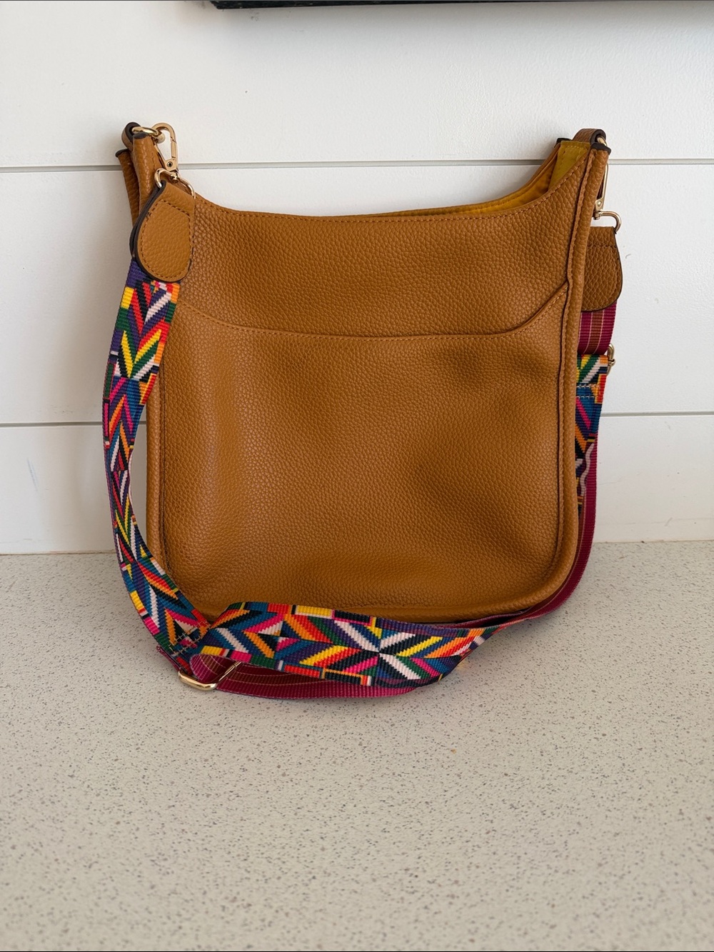 Tan Pebbled Crossbody Bag with Colorful Woven Strap